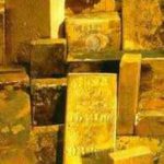 Gold eases as stronger dollar, higher yields weigh